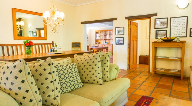 The living room and open plan dining area in the Farmhous at Bonnievale River Lodge